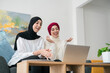 © Studio Marmellata/Stocksy - Delighted Arab women having video call on laptop