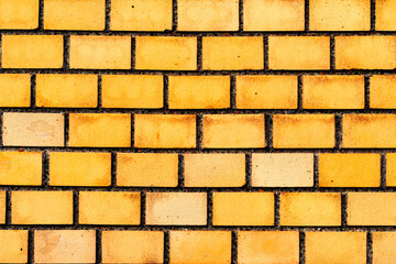 Texture of a brick wall with cracks and scratches which can be used as a background