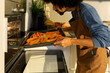 © Valentina Barreto/Stocksy - man cooking vegan food at home