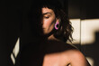 © Ana Luz Crespi/Stocksy - Jewelry model looking pensive