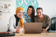 © Studio Marmellata/Stocksy - Female colleagues talking on video chat on laptop in office