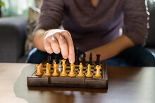 Man Playing Chess At Home