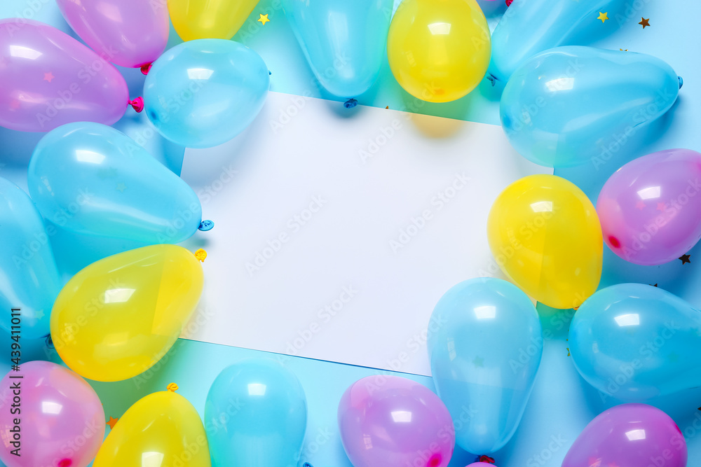 Blank paper sheet with air balloons on color background