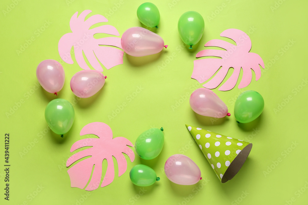 Frame made of air balloons on color background