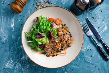 Wall Mural - Grilled meat steak and fresh vegetables salad