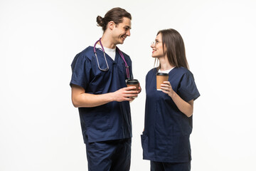 Wall Mural - two medics drink coffee isolated on white background