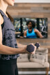 © Sean Locke/Stocksy - Home: Woman Weight Trains With Remote Streamed Class