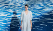 © Audrey Shtecinjo/Stocksy - Stylish Fashion Female Model In Front Of The Abstract White And Blue Space.