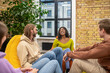 © zinkevych - Laughing darkskinned girl with friends in youth organization