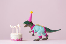 Dinosaur Blowing Out Birthday Cake Candles