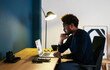 © BONNINSTUDIO/Stocksy - Black freelancer thinking over project in workplace