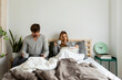 © Valentina Barreto/Stocksy - couple relaxing on bed drinking coffee