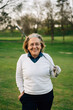 © Sergio Marcos/Stocksy - Golfer woman portrait