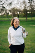 © Sergio Marcos/Stocksy - Golfer woman portrait