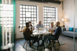 © Mihajlo Ckovric/Stocksy - Businesspeople having a meeting in the office
