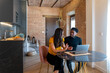 © Bisual Studio/Stocksy - Diverse freelancers talking during work at home