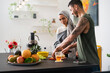 © Studio Marmellata/Stocksy - Muslim couple preparing healthy food and talking