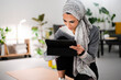 © Studio Marmellata/Stocksy - Muslim sportswoman using tablet during break