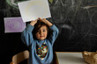 © Valentina Barreto/Stocksy - Little kid showing the picture looking at camera