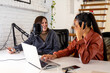 © Bisual Studio/Stocksy - Diverse colleagues recording an online podcast