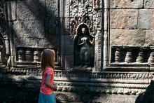 Little Girl Exploring Angkor Wat In Cambodia