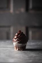 Solitary Chocolate Cupcake With Rich Chocolate Frosting Swirls