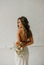 Young Bride Holding Dried Flower Bouquet