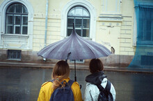 Rainy Day For Friends With An Umbrella