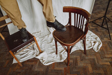 
Portrait Of The Feet Of A Red-haired Guy Walking In Chairs