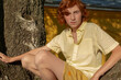 © Irina Ozhigova/Stocksy - Red-haired, pretty boy on a tree