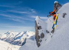 Male Skier Jumping From Mountain Cliffs