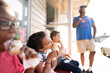 © Jennifer Bogle/Stocksy - Family eats ice cream on an outdoor bench