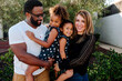 © Erin Brant/Stocksy - Happy family smiling at home
