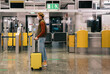 © Alina Hvostikova/Stocksy - Male traveler in mask in airport terminal
