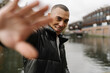 © Mattia/Stocksy - Smiling Man with Hand Stop