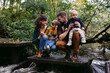 © Rob and Julia Campbell/Stocksy - Fun young family exploring the creek together.