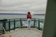 © Caleb MacKenzie Gaskins/Stocksy - Unknown woman riding the ferry