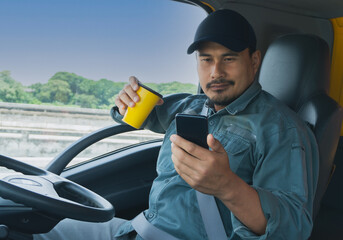 Wall Mural -  truck driver Video call on the smartphone