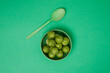 © French Anderson Ltd/Stocksy - Bowl of with a green spoon