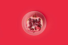 Little Pink Plate With Half A Pomegranate