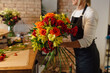 © Boris Jovanovic/Stocksy - A Photo of A Woman Arranging A Bouquet