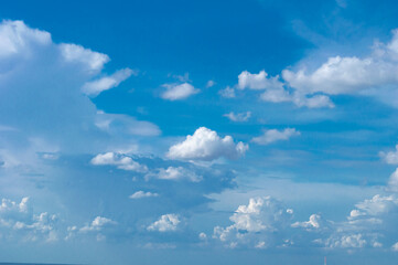 Wall Mural - blue sky background with tiny clouds. panorama white fluffy clouds in the blue sky.beautiful vast bl