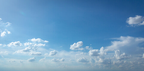 Wall Mural - blue sky background with tiny clouds. panorama white fluffy clouds in the blue sky.beautiful vast bl