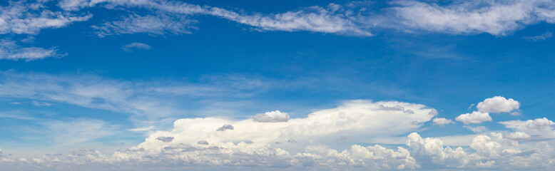 Wall Mural - blue sky background with tiny clouds. panorama white fluffy clouds in the blue sky.beautiful vast bl