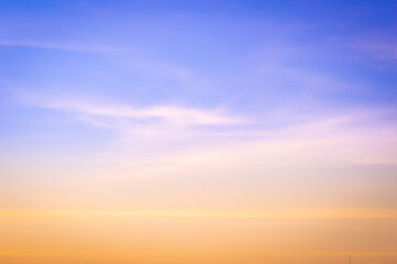 Wall Mural - beautiful sky painted by the sun leaving bright golden shades.dense clouds in twilight sky in winter