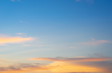 Wall Mural - beautiful sky painted by the sun leaving bright golden shades.dense clouds in twilight sky in winter