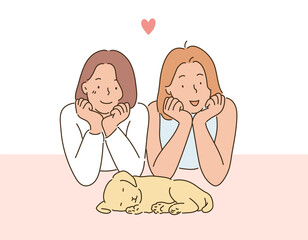 Two girls with their chins crossed and looking at a sleeping puppy. hand drawn style vector design illustrations. 