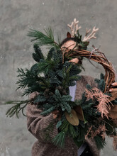 Person With Christmas Wreath