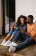 © VICTOR TORRES/Stocksy - Delighted couple drinking beer at home together