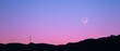 © JIACHUAN LIU/Stocksy - moon on the mountain